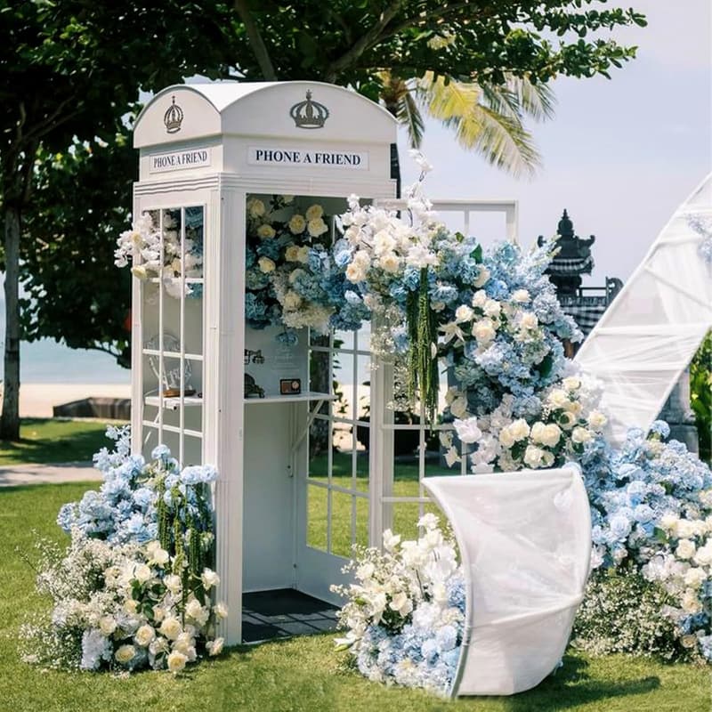 White wedding telephone booth with blue and white floral decor
